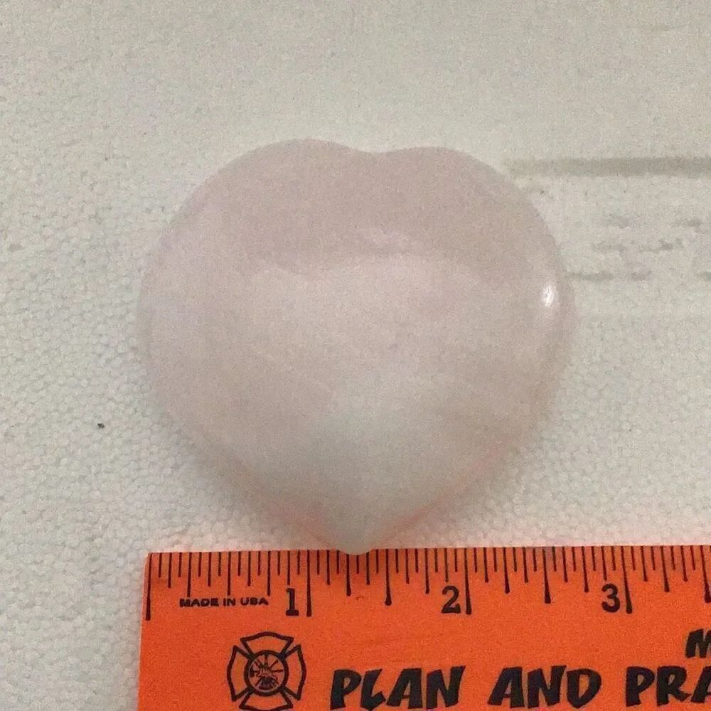 Translucent carved heart healing stone